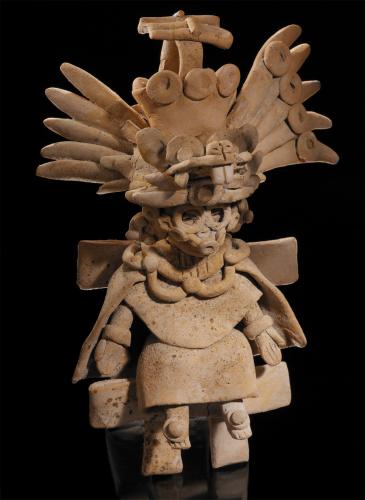 A tan-colored statue of a figure wearing an elaborate ensemble