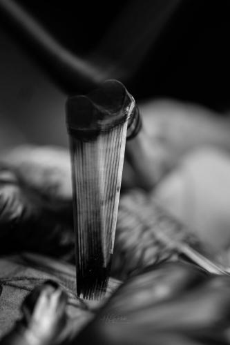 Closeup of a moli tool tapping ink into skin
