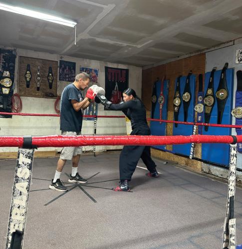Mariah Bahe trains with her father in a boxing gym