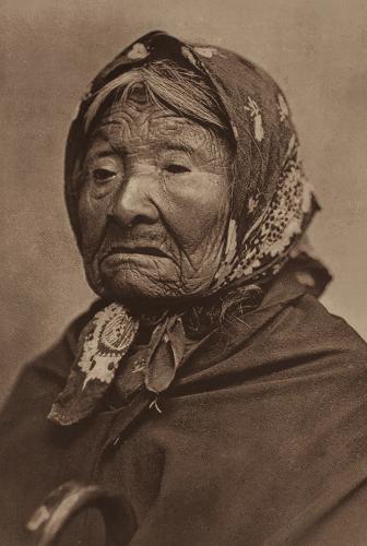 An antique portrait of a woman wearing a kerchief