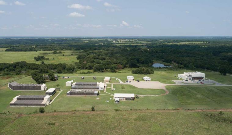 Aerial view of a group of buildings in a green landscape