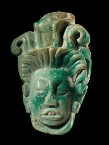 A carved greenstone pendant of the Mayan maize god Hun Hunahpu