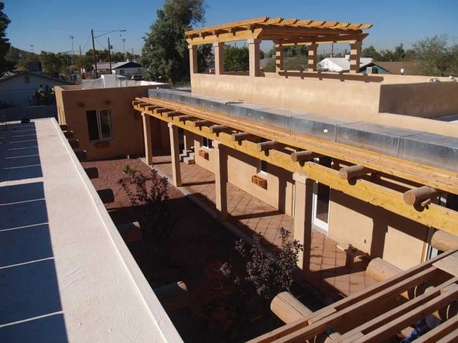 Aerial view of the courtyard of an adobe-style home