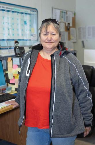 Napakiak Mayor Joann Slats standing in an office.