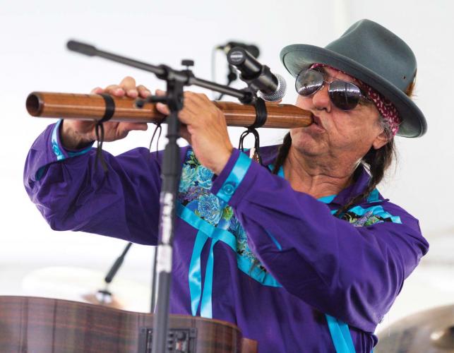 Musician Keith Secola plays traditional flute.