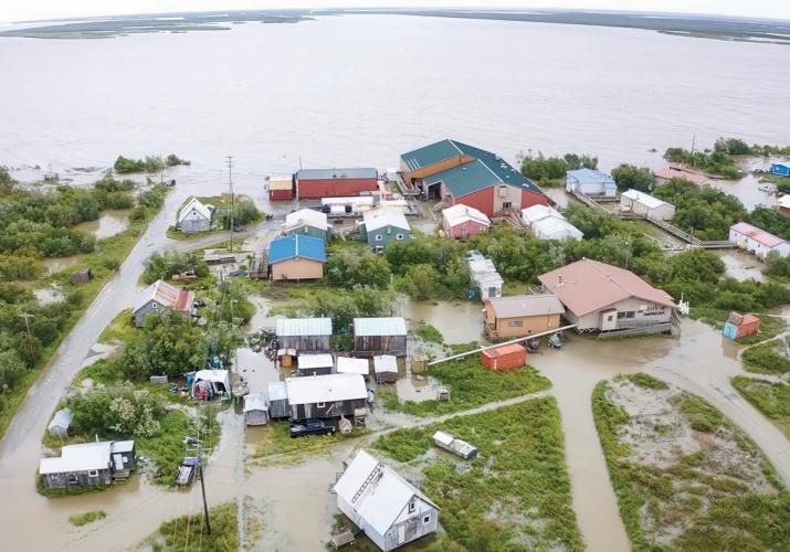 Aerial view of an Alaskan village flooded with water.