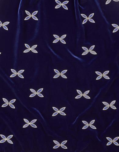 Detail of quillwork pattern on dark blue fabric