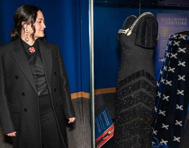 Lily Gladstone viewing display of gowns at the National Museum of the American Indian in Washington, D.C.