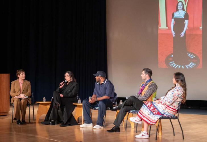 Lily Gladstone joins quillmakers and a moderator on stage participating in a group discussion
