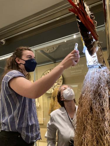 Museum team inspects garments for crystals
