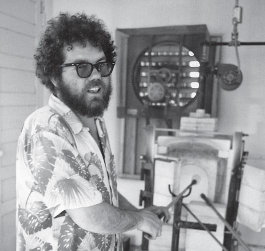 Dale Chihuly in his studio with glass blowing equipment.