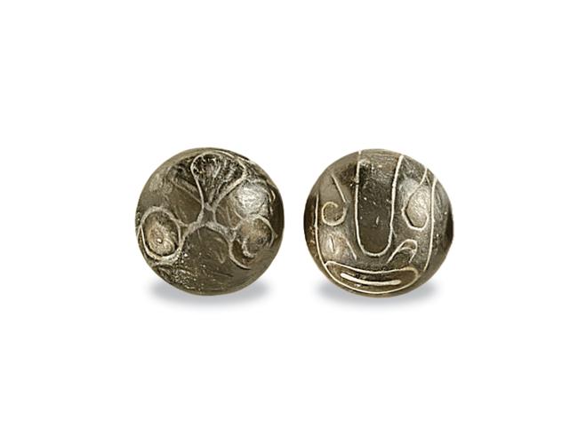 Illustration of two stones with etched patterns