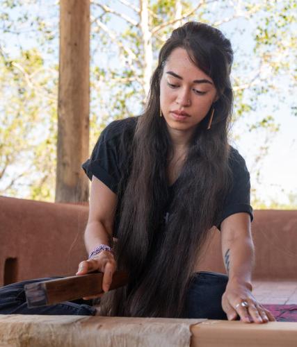 Lehuauakea works with bark cloth in her studio