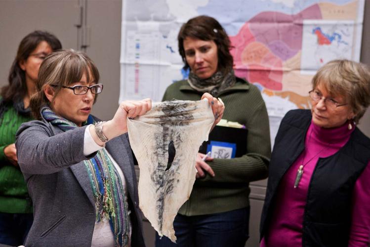 Workshop participants analyze a piece of salmon skin