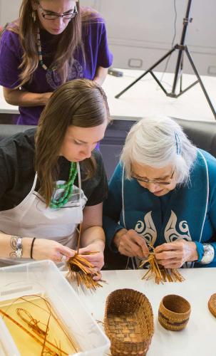 Workshop attendees use cedar to weave small baskets