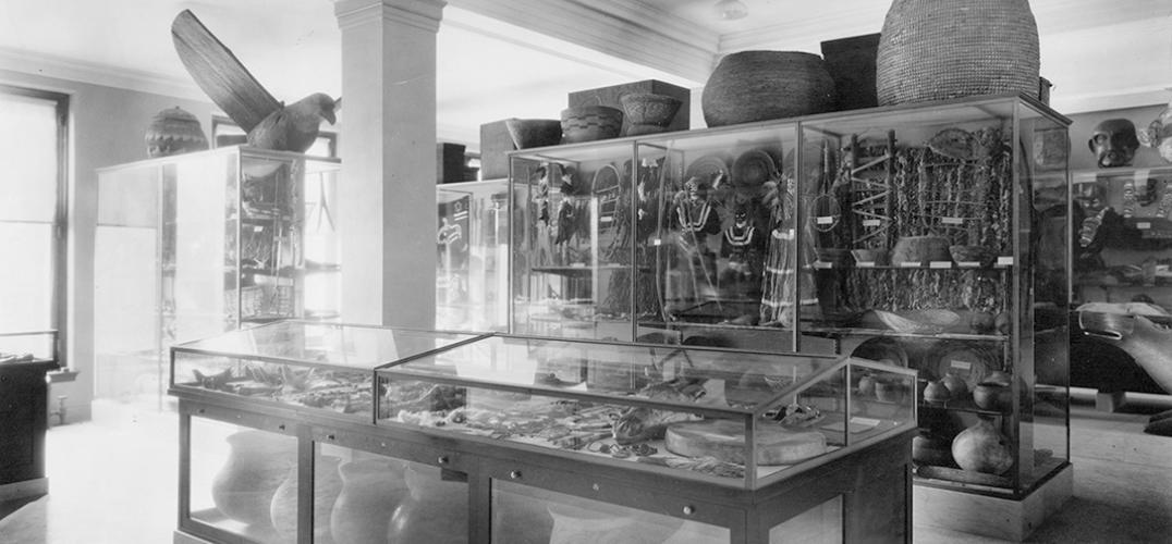 Black and white photograph of a museum showcasing art and artifacts