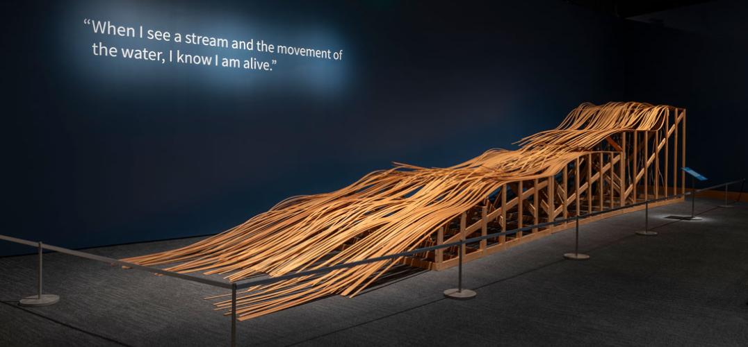 Large wooden sculpture depicting river water 