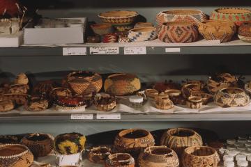 Pomo baskets stored on open shelving in the Research Branch of the NMAI