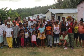 Community gathering for a tobacco ceremony honoring a baptism