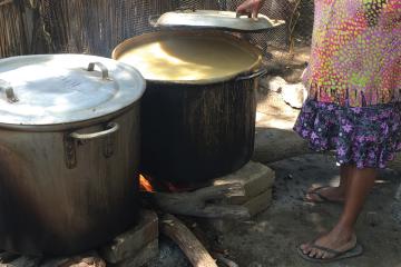 woman brewing chicha
