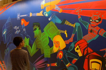 Child viewing murals