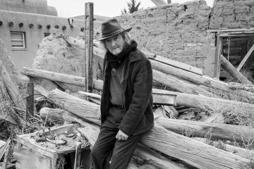 Victor David López sitting on rubble
