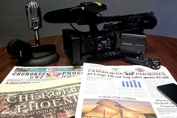 Camera and newspapers