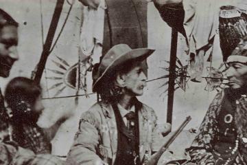 William “Buffalo Bill” Cody talking with one of the Lakota performers in his Buffalo Bill’s Wild West show