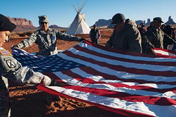Members of the Oljato and Kayenta Veterans Associations refold an American flag