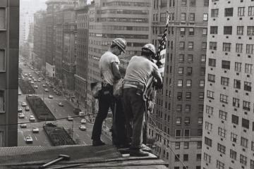 Kahnawake Mohawk ironworkers Jay Jacobs and Sparky Rice place a flag on a building in Midtown Manhattan