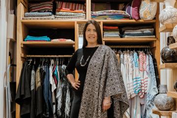 Heidi McKinnon stands in her Santa Fe shop.