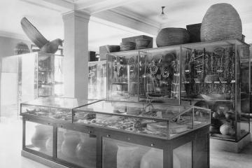 Black and white photograph of a museum showcasing art and artifacts