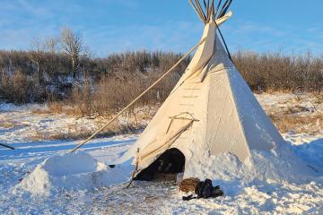 A tipi in the snow.