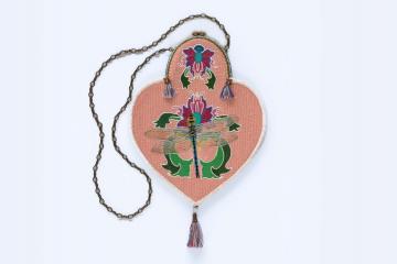 Pink beaded purse depicting flowers and a dragonfly